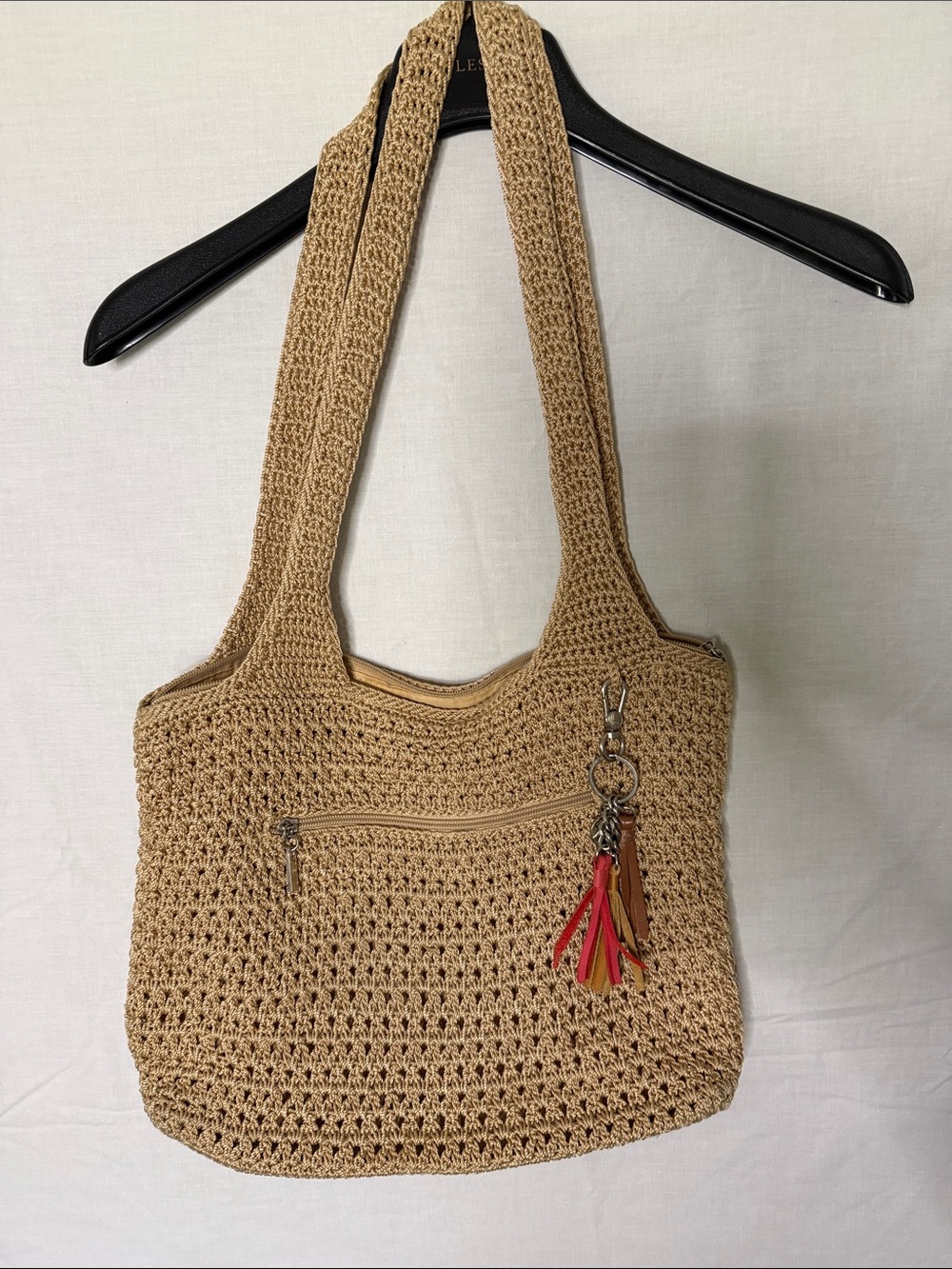 The Sak Crochet Shoulder Bag in Beige with Red & Tan Tassels